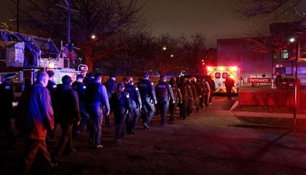 The body of slain Chicago police officer Samuel Jimenez at the shooting at the Mercy Hospital is being escorted to the Medical Examiner Office