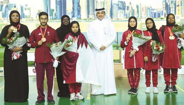 Qatar medal winners celebrate with the president of Qatar Shooting and Archery Association Ali Mohamed al-Kuwari yesterday. PICTURE: Ram Chand