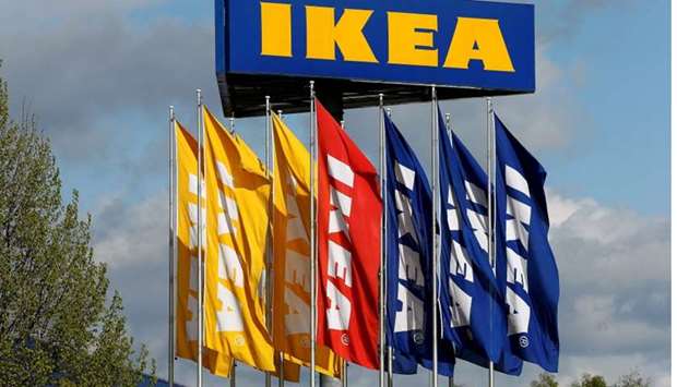 Flags and the company's logo are seen outside of an IKEA Group store in Spreitenbach, Switzerland on April 27, 2016.