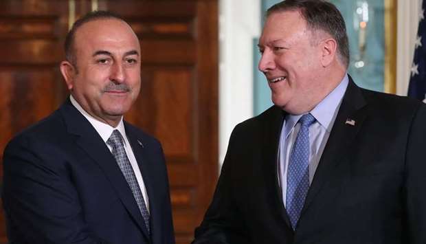 US Secretary of State Mike Pompeo (R) meets with Turkish Foreign Minister Mevlut Cavusoglu, at the Department of State, yesterday in Washington