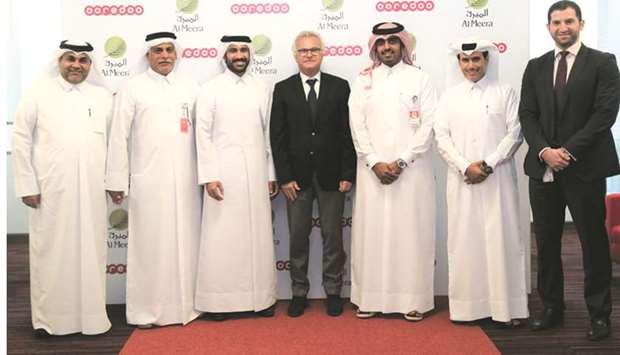 Yousuf Abdulla al-Kubaisi with Sheikh Nasser bin Hamad bin Nasser al-Thani, chief business officer, Ooredoo, and executives from both Ooredoo and Al Meera.
