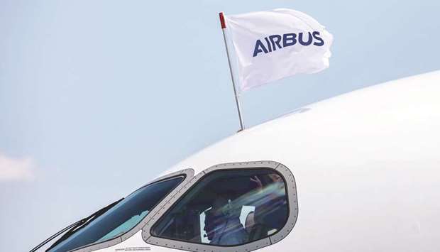 A flag flies above the cockpit of a new Airbus A220 single-aisle aircraft. Airbus has sold 1,200 aircraft, has a backlog of nearly 600 and nearly 700 in operation throughout Latin America and the Caribbean, representing a 56% market share of the in-service fleet.
