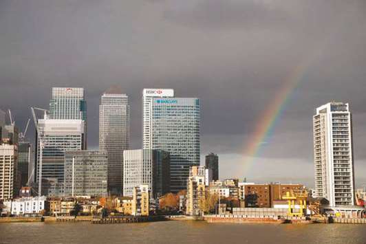 A rainbow appears over the financial district of Canary Wharf in east London.
