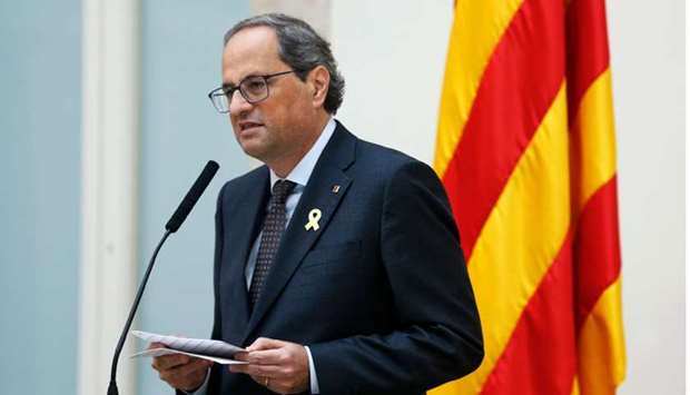 Catalan regional president Quim Torra speaks to the press at the Catalan regional parliament's auditorium in Barcelona