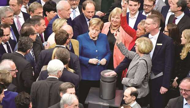 German Chancellor Angela Merkel and MPs prepare to vote for the chancellery budget during a debate on the budget at the Bundestag in Berlin.