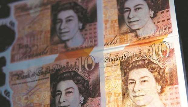 British ten pound sterling notes are arranged for a photograph in London (file). The pound jumped yesterday after Britain and the European Union struck a crucial draft deal on post-Brexit ties.