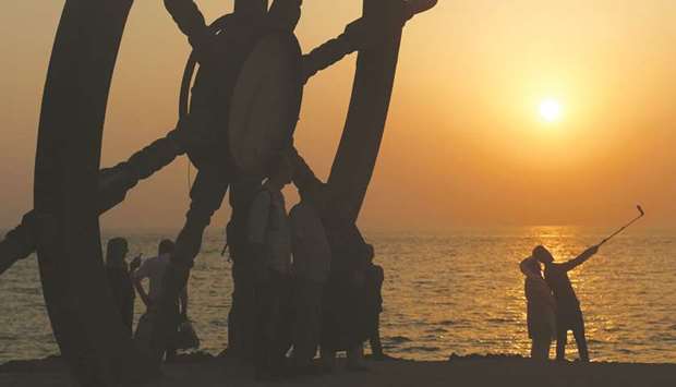 Iranians take a selfie on the sea front during sun set in Iranu2019s southern resort island of Kish (file). On paper, US sanctions permit Iranian purchases of humanitarian goods like medicines. To avoid accidentally triggering penalties, foreign drug companies and international banks are taking extra precautions even when dealing with permitted business. The new legal complications, along with panic buying and hoarding, mean some drugs are increasingly difficult to find.