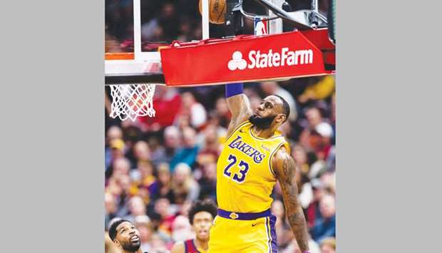 LeBron James of the Los Angeles Lakers dunks during the first half of the NBA game at Quicken Loans Arena in Cleveland, Ohio, on Wednesday. (AFP)