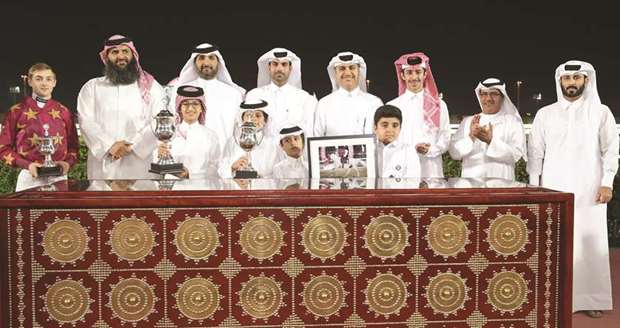 Winners of the Doha Cup with the trophies and officials after Rassan won the 1200m race at the Qatar Racing and Equestrian Clubu2019s Al Rayyan Park yesterday. PICTURES: Juhaim