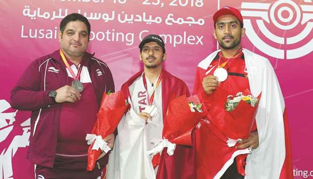 (From left) Second-placed Riaz Khan of Qatar, winner Ahmed Zayed al-Shammari of Qatar and third-placed Muad al-Balushi of Oman pose with their 25m standard pistol medals yesterday. PICTURES: Ram Chand