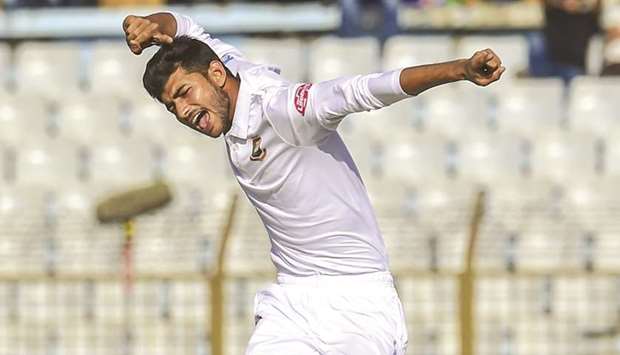Bangladeshu2019s Nayeem Hasan celebrates the dismissal of West Indiesu2019 Kemar Roach on second day of the first Test at the Zahur Ahmed Chowdhury Stadium in Chittagong, Bangladesh, yesterday. (AFP)