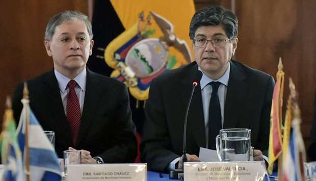 Ecuadoran Foreign Minister Jose Valencia (R) and Ecuadorean Vice-Minister of Human Mobility
