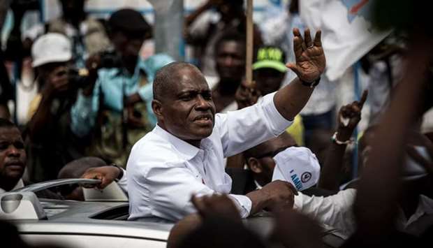 Democratic Republic of Congo joint opposition presidential candidate Martin Fayulu (C) waves to supporters from a car as he arrives in Kinshasa to launch his campaign on November 21, 2018. AFP