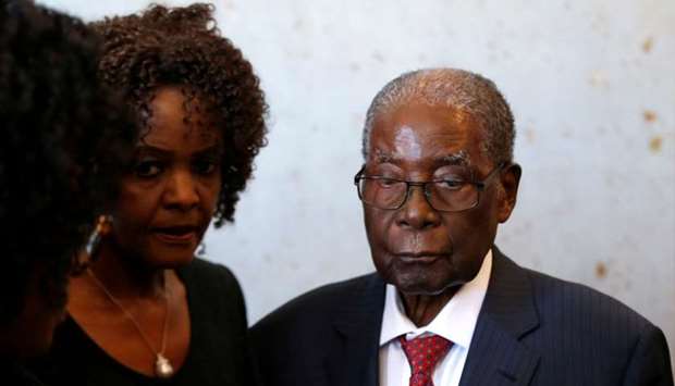 Robert Mugabe and his wife Grace look on before voting in the general elections in Harare, Zimbabwe on July 30, 2018