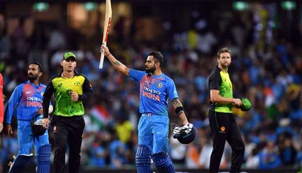 India's batsman Virat Kohli celebrates his team's victory against Australia in a T20 international cricket match at the SCG in Sydney 
