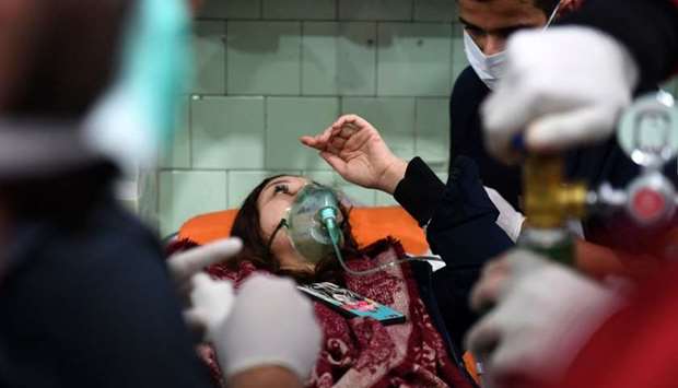 A Syrian woman receives treatment at a hospital in the regime controlled Aleppo.