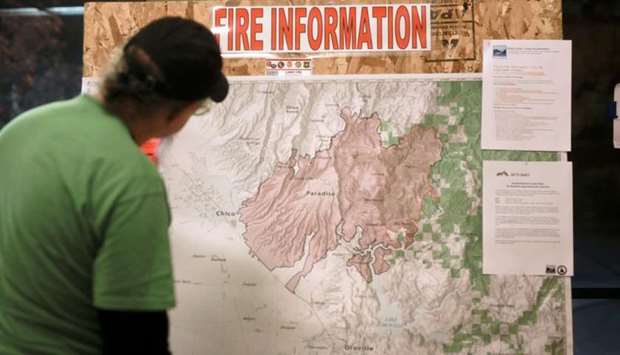 A man looks at a map of the Camp Fire at a Red Cross shelter in Chico, California, US