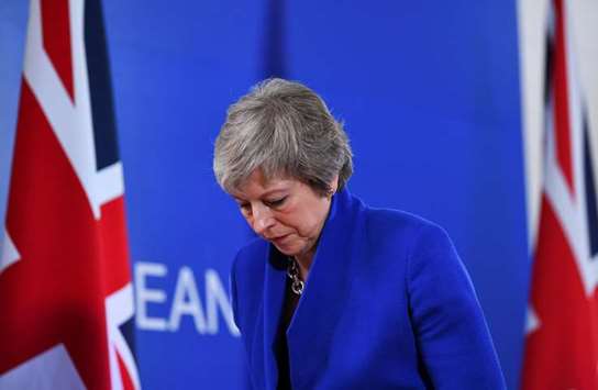 Prime Minister Theresa May leaves after a news conference following an extraordinary EU leaders summit to finalise and formalise the Brexit agreement in Brussels, Belgium, yesterday.