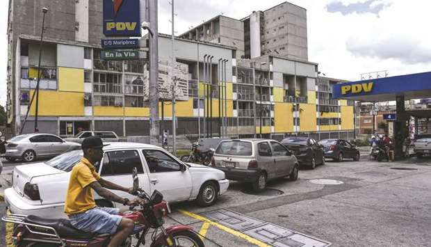 Vehicles waiting for fuel at a Petroleos de Venezuela (PDVSA) gas station in Caracas. PDVSAu2019s refineries are running at less than a quarter of their capacity, forcing the country to rely on imported gasoline.