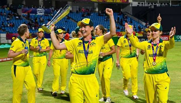 Australia's players celebrate winning the ICC Women's World T20 final cricket match against England
