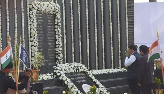 Devendra Fadnavis, Chief minister of Maharashtra, pays respect at the Police Memorial, during an event to commemorate the 10th anniversary of the 2008 Mumbai militant attacks