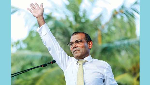 Mohamed Nasheed waves as he addresses the country after returning from exile in Male last month.
