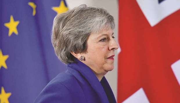 FILE PHOTO: Britainu2019s Prime Minister Theresa May attends a news conference after an extraordinary EU leaders summit to finalise and formalise the Brexit agreement in Brussels, Belgium November 25, 2018.