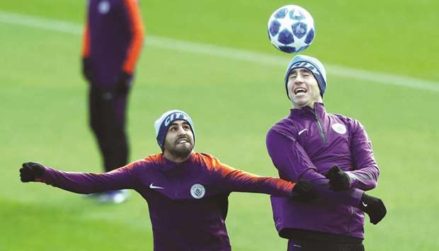Manchester Cityu2019s Riyad Mahrez and Aymeric Laporte during a training session yesterday.