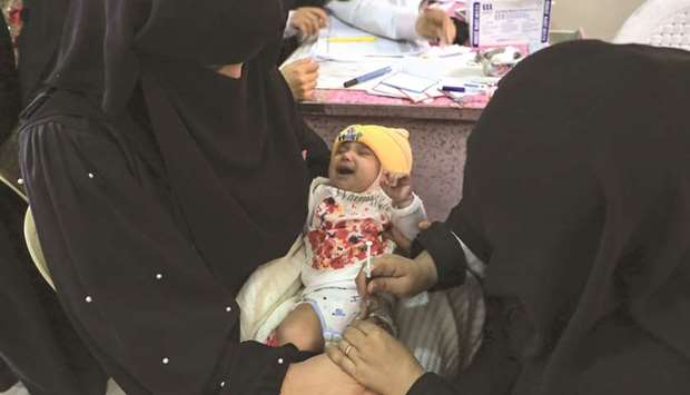 A Yemeni child receives a polio vaccination during an immunisation campaign at a health centre on the outskirts of the capital Sanaa, yesterday.