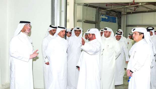 HE the Prime Minister and Interior Minister Sheikh Abdullah bin Nasser bin Khalifa al-Thani listens to a briefing while touring the four new Manateq Warehousing Parks.