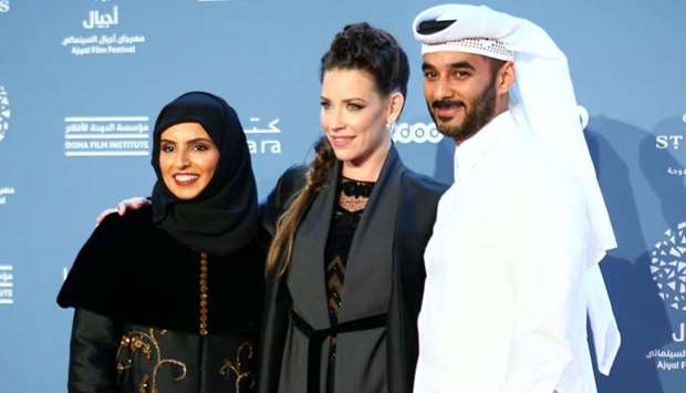 (From left) Fatma Hassan al-Remaihi, Evangenline Lilly and DFI's chief administrative officer and Ajyal deputy director Abdulla al-Musallam on the red carpet, marking the opening of Ajyal Film Festival 2018 at Katara. PICTURE: Ram Chand.