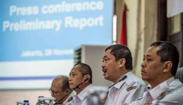 Indonesia's National Transportation Safety Commission's (KNKT) deputy head Haryo Satmiko (2nd R) delivers a preliminary report on Lion Air flight JT 610 during a press conference in Jakarta