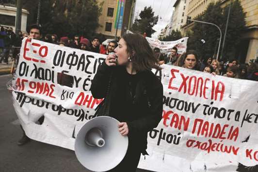 A student shouts slogans during an anti-fascist demonstration in Athens.