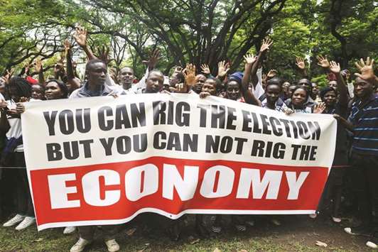 Supporters of Zimbabweu2019s opposition party Movement for Democratic Change Alliance take part in a march in Harare yesterday against a worsening economic situation in the country.