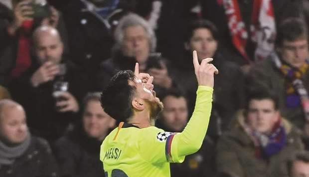 Barcelonau2019s Argentine forward Lionel Messi celebrates after scoring during the UEFA Champions League football match between PSV Eindhoven and FC Barcelona at Philips stadium in Eindhoven on Wednesday.