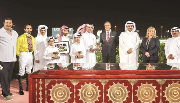 Argentinau2019s ambassador to Qatar Carlos Hernandez (fourth from right), QREC general manager Nasser Sherida al-Kaabi (third from right) and QREC Racing manager Abdulla Rashid al-Kubaisi (right) with the winners of the Thoroughbred Guineas (Gr3) after Prepare For Battle won the mile-long race at the Al Rayyan Park yesterday. PICTURES: Juhaim