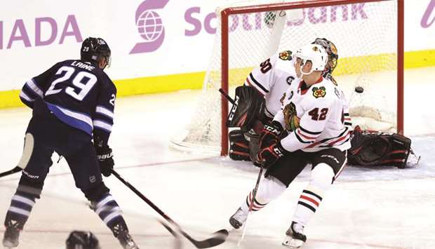 Winnipeg Jets right wing Patrik Laine scores against Chicago Blackhawks goaltender Corey Crawford in the third period at Bell MTS Place. PICTURE: USA TODAY Sports