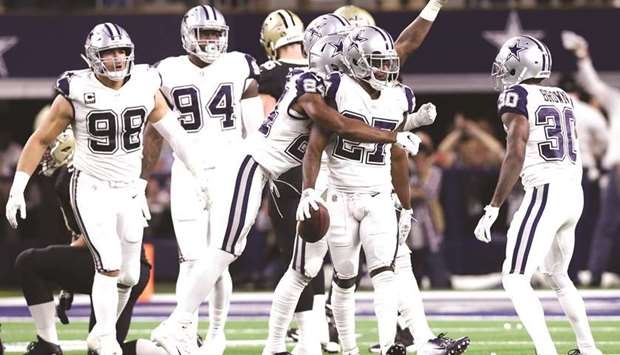 Dallas Cowboys cornerback Jourdan Lewis (second right) celebrates his fourth quarter interception against the New Orleans Saints. PICTURE: USA TODAY Sports