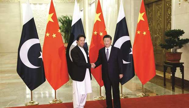 Chinau2019s President Xi Jinping (right) shakes hands with Pakistanu2019s Prime Minister Imran Khan ahead of their meeting at the Great Hall of the People in Beijing yesterday. u201cI attach great importance to China-Pakistan relations and am willing to work together with the prime minister to strengthen the China-Pakistan all-weather strategic partnership and build a new era of China-Pakistan destiny,u201d Xi said.