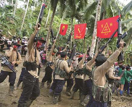 File photo shows members of the New Peopleu2019s Army (NPA) in the Sierra Madre mountain range.