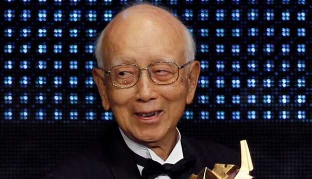 Veteran Hong Kong producer Raymond Chow, who introduced Bruce Lee and Jackie Chan to the movie world, receives the Lifetime Achievement award during the Asian Film Awards presentation ceremony in Hong Kong, China.  March 21, 2011 file picture.