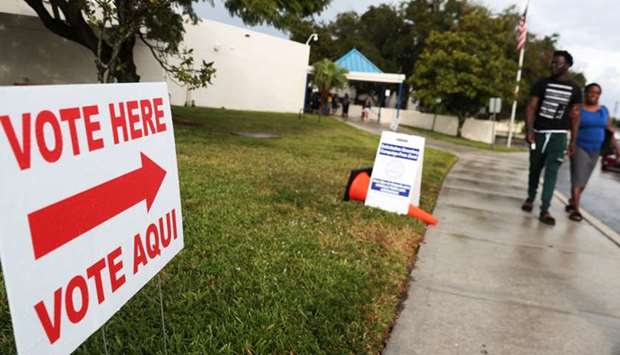 People leave an early voting site in Boynton Beach, Florida, US. Reuters