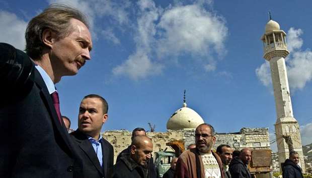 In this file photo taken on March 02, 2007, Geir Pedersen (L), then UN special coordinator for Lebanon, walks alongside Hezbollah deputy Hassan Fadlallah (2nd L) and other officials during their tour in the devastated town of Bint Jbeil in south Lebanon.
