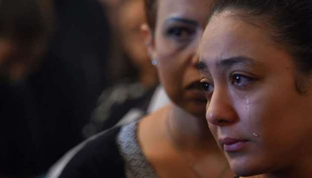 A Coptic Christian woman mourns victims killed in an attack a day earlier, during an early morning ceremony at the Prince Tadros church in Egypt's southern Minya province.