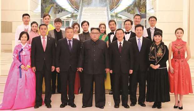 North Korean leader Kim Jong-un (centre) posing with North Korean and Chinese artists while attending a joint performance at the Mansudae Art Theatre in Pyongyang.