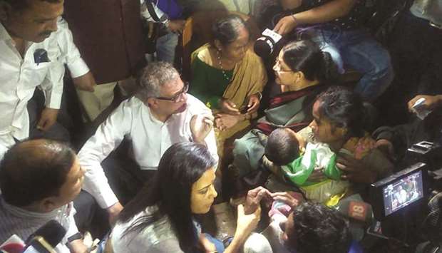 Trinamool Congress leader Derek Ou2019 Brien meets the family of five people killed by suspected militants in Assamu2019s Tinsukia district yesterday.