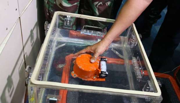 A flight data recorder, part of the ill-fated Lion Air flight JT 610's black box, is seen after it was recovered from the Java Sea, during search operations in the waters off Karawang on November 1, 2018.