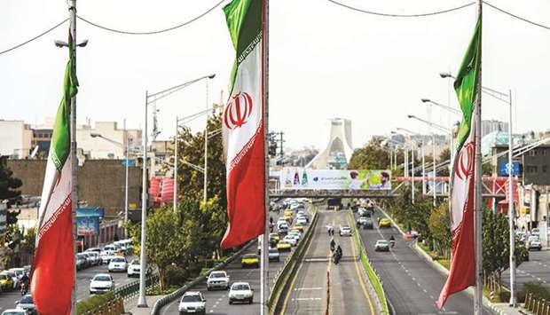 National flags of Iran fly above Azadi avenue in Tehran on Saturday. The US offensive to cripple the countryu2019s economy went full throttle yesterday, with renewed sanctions on buying Iranian oil, the countryu2019s lifeline.