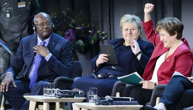 The President of Burkina Faso, Roch Marc Christian Kaboru00e9 (L), Norwayu00b4s Prime Minister Erna Solberg (C) and the Chief Executive Officer of the World Bank Kristalina Georgieva (R) attend an international conference on health in developing countries in Oslo
