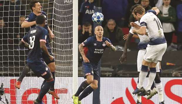 Tottenham Hotspuru2019s Harry Kane (right) scores against PSV Eindhoven during the Champions League group B match at Wembley Stadium in London. (AFP)